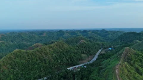 Serene blue sky frames the peaceful countryside setting. Stock Footage 337258942