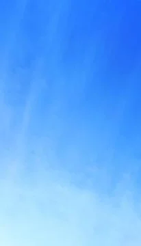 Serene Blue Sky Gradient with Light Clouds background Stock Photos