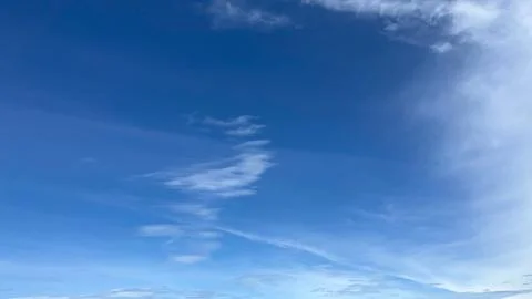 Serene Blue Sky with Wispy Clouds Stock Photos