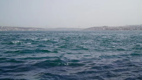 Serene Bosphorus Strait, featuring Istanbul's skyline, a connecting bridge, and Stock Footage 280437330