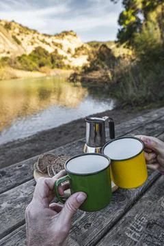 Serene Breakfast: Bread, Coffee and Toast by the Tranquilo River Stock Photos