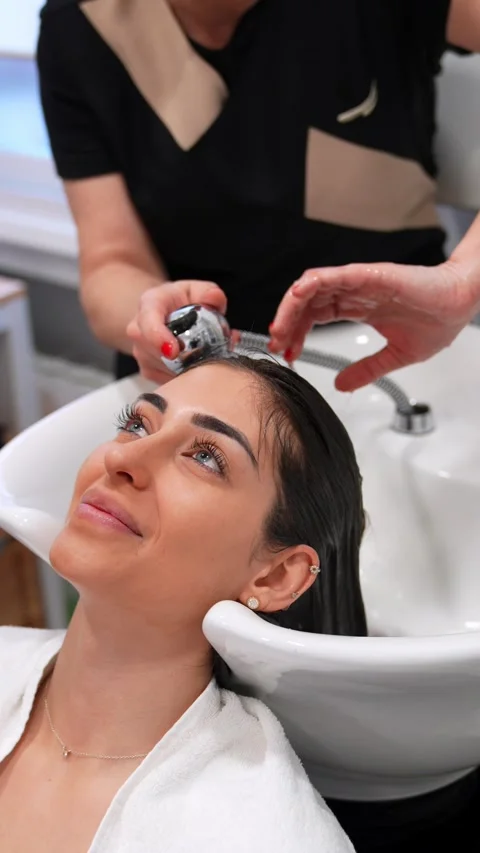 Serene Client Undergoing Pre-Treatment Scalp Wash for Therapy Stock Footage 271351088