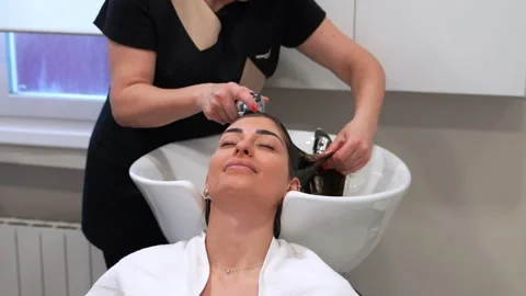 Serene Client Undergoing Pre-Treatment Scalp Wash for Therapy Stock-Footage 271353367