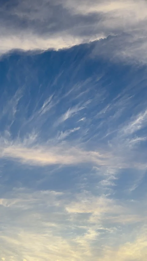 Serene Cloudscape on Blue Sky – Vertical Orientation 스톡 동영상 332554192