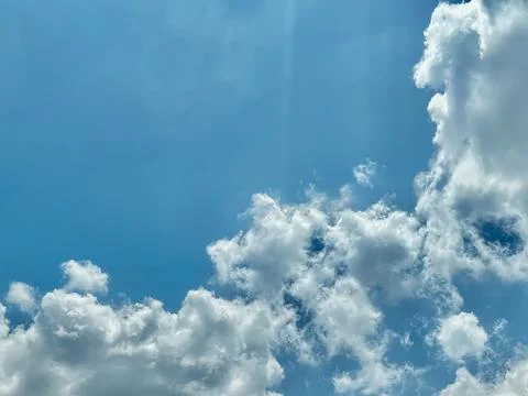 Serene Cloudy Sky with Soft Clouds and Light Blue Backdrop Wallpaper Stock Photos