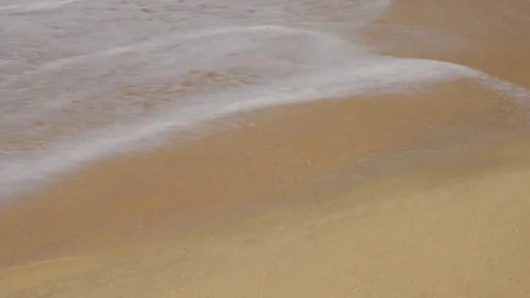 A Serene Coastal Landscape Captured in Two Frames Illustrating the Gentle Stock Footage 310055053