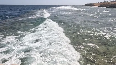 Serene Coastal Scene Captured in Two Frames Highlighting the Clear Blue Waters 库存影片 330697391