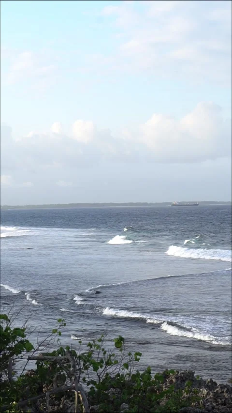 Serene Coastal View with Gentle Waves Stock Footage 283207255