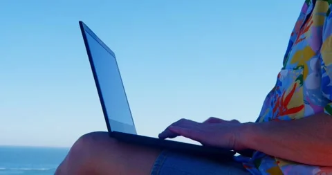 Serene Computing: A person works on a laptop Видео 333232270