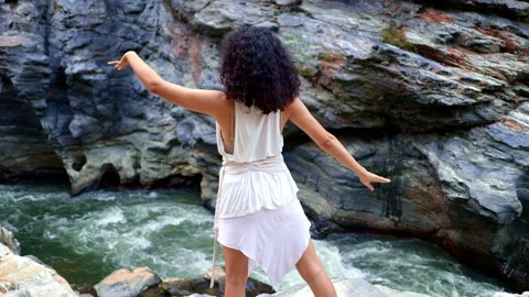 A Serene Connection in Nature: Demonstrating Movement and Expression Against a Stock Footage 315549537
