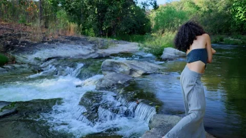 A Serene Dance by the River: A Captivating Journey of Movement and Harmony Stock Footage 319035705