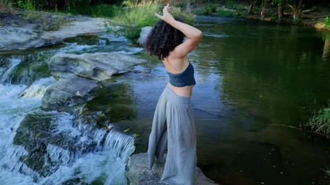 A Serene Dance by the Water: Capturing the Grace and Beauty of Movement Amidst Video stock 314876922