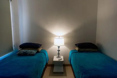 Serene Double Bedroom with Modern Bedside Lamp Stock Photos
