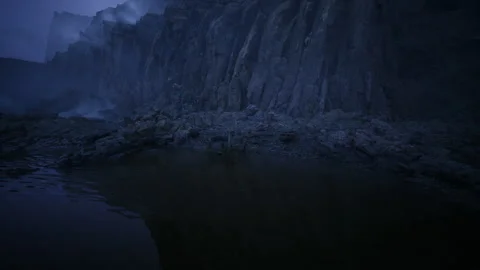 Serene dusk by basalt cliffs and tranquil shallow pool with textured surface Stock Footage 342433314