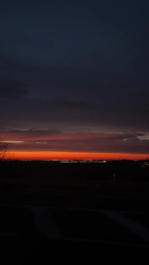 Serene dusk with silhouetted trees and glowing horizon in landscape scene Stock Footage 335366245