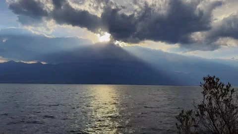 Serene Erhai Lake Under Dramatic Clouds and Distant Mountains, Dali, Yunnan Stock Footage 337345682
