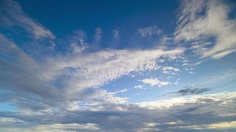 The Serene Evening Sky Showcasing Dynamic and EverChanging Cloud Patterns Above Stock Photos