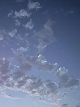 Serene Evening Sky with Soft Clouds Stock Photos
