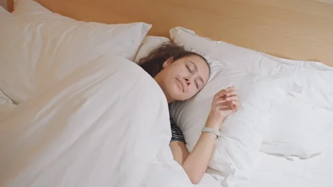 Serene evening transitioning into tranquil sleep. Exhausted individual Stock Footage 337724348