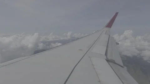 Serene Flight Above Clouds with Wing View and Text Space Stock Footage 265842090