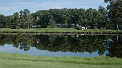 Serene Golf Course Pond with Tree Reflections 動画素材 332710333