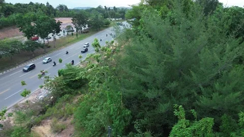Serene Green Landscape Framing Continuous Vehicle Movement on a Multi-lane .. Video stock 339037122