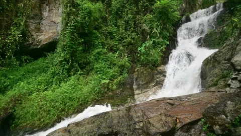 Serene Kaew Waterfall Cascading Through Lush Green Landscape in Chiang Mai Stock Footage 315490697