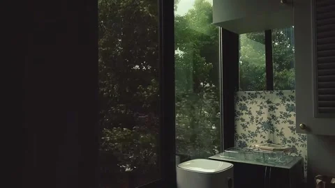 Serene Kitchen Corner with Big Window Overlooking Lush Garden Stock Footage 337460735