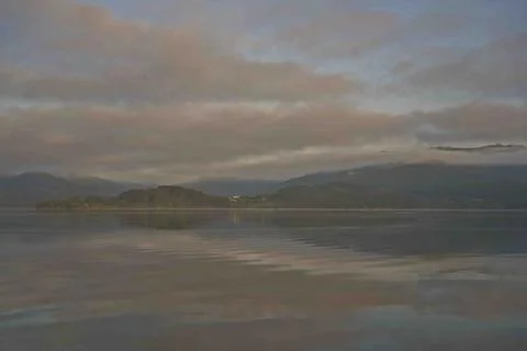 Serene Lake with Cloud Reflections Stock Photos