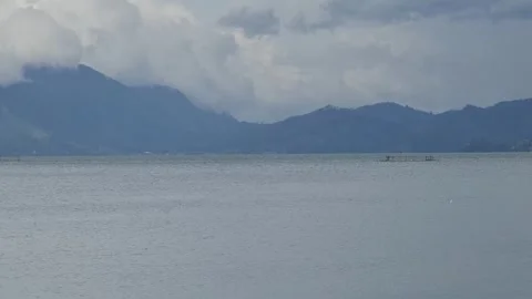 Serene Lake with Distant Mountains Stock Footage 291379111