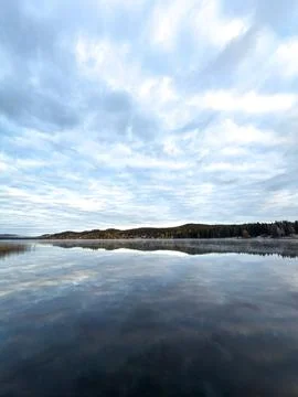 Serene Lake Landscape with Dramatic Sky and Forest Reflection in Sweden Stock Photos