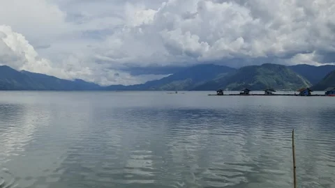 Serene Lake with Mountain and Cloud Reflections Stock Footage 291378284