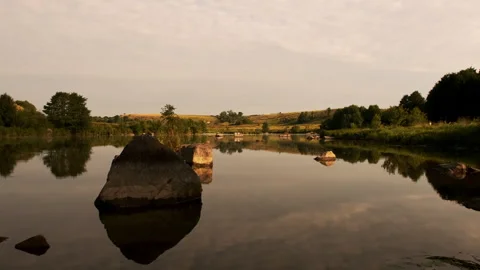 Serene Lake with Reflections of Trees and Sky Stock Footage 301454652