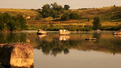 Serene Lake with Reflections of Trees and Sky Stock Footage 301454699