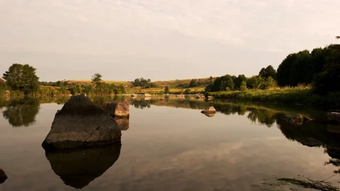 Serene Lake with Reflections of Trees and Sky Stock Footage 301454797