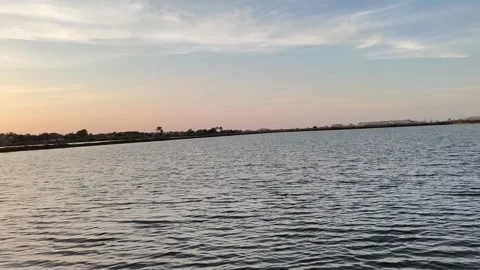 Serene Lake Sunset Background with Rippling Water Surface Video stock 341506113