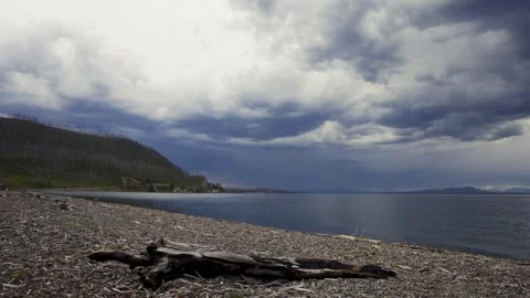 Serene Lakeside View with Dramatic Clouds Stock Footage 303941598
