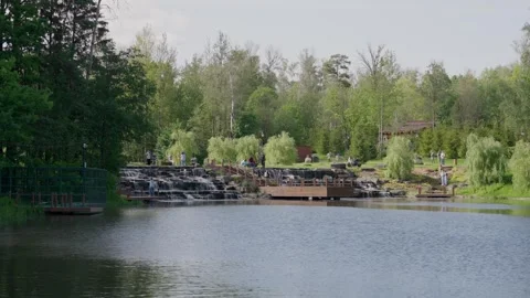 A Serene Lakeside View featuring Lush Greenery Enhanced by Beautiful, Tranquil 스톡 동영상 311892757