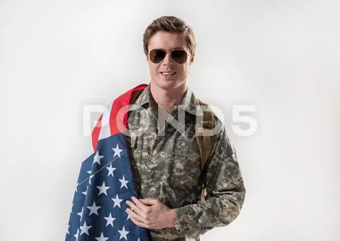 Serene male soldier is proud of his country Stock Photos