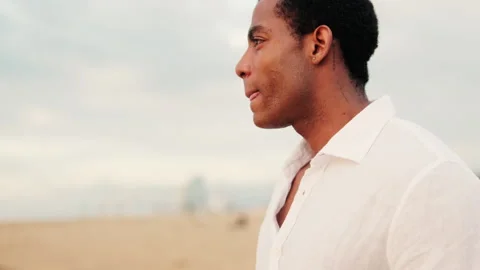 Serene Man Contemplating on a Beach Stock Footage 313812929