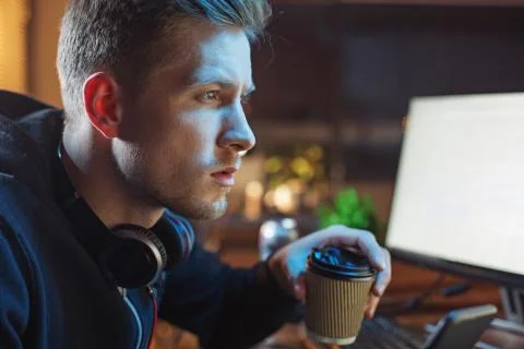 Serene man drinking beverage during job Stock Photos