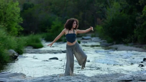 A Serene Moment by the River: Capturing the Tranquility of Nature and Reflection Stock Footage 314858210