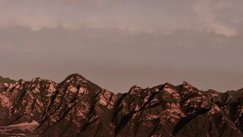 Serene Mountain Crests Twilight Tracking Left 4K HLG Stock Footage 344013705