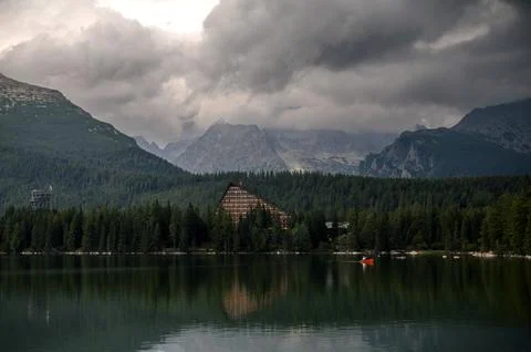 Serene Mountain Lake with Triangular Building Stock Photos