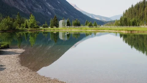 Serene Mountain Reflection on Crystal Clear Lake Video stock 255968072