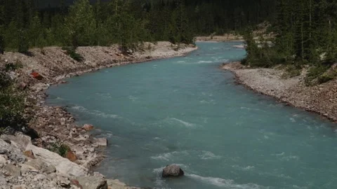 Serene Mountain River Flowing Through Rocky Landscape Stock Footage 255967526