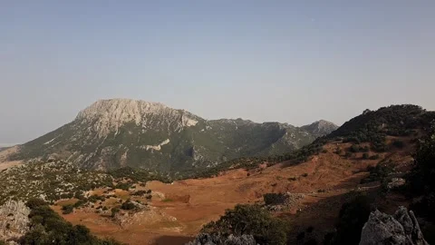 Serene mountain scene unfolds with Mount Kelti rising in the distance; on clear Stockbeeldmateriaal 337139946