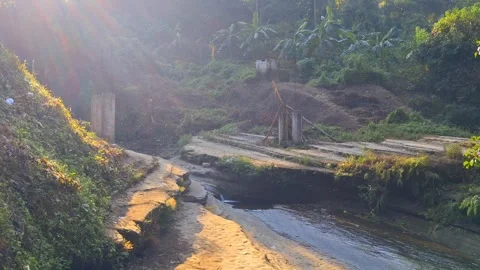 Serene mountain stream flowing through lush landscape Vídeo Stock 331657823