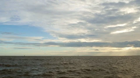 Serene Ocean Seascape with Dramatic Cloudy Sky Stock Footage 318522415