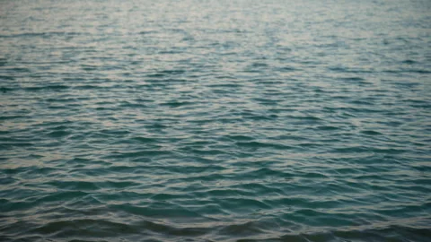 Serene ocean water surface with gentle waves and rippling blue texture, con.. Stock Footage 346766215